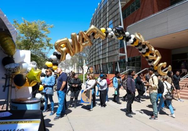 Balloon arch spelling out the words GRAD FAIR 